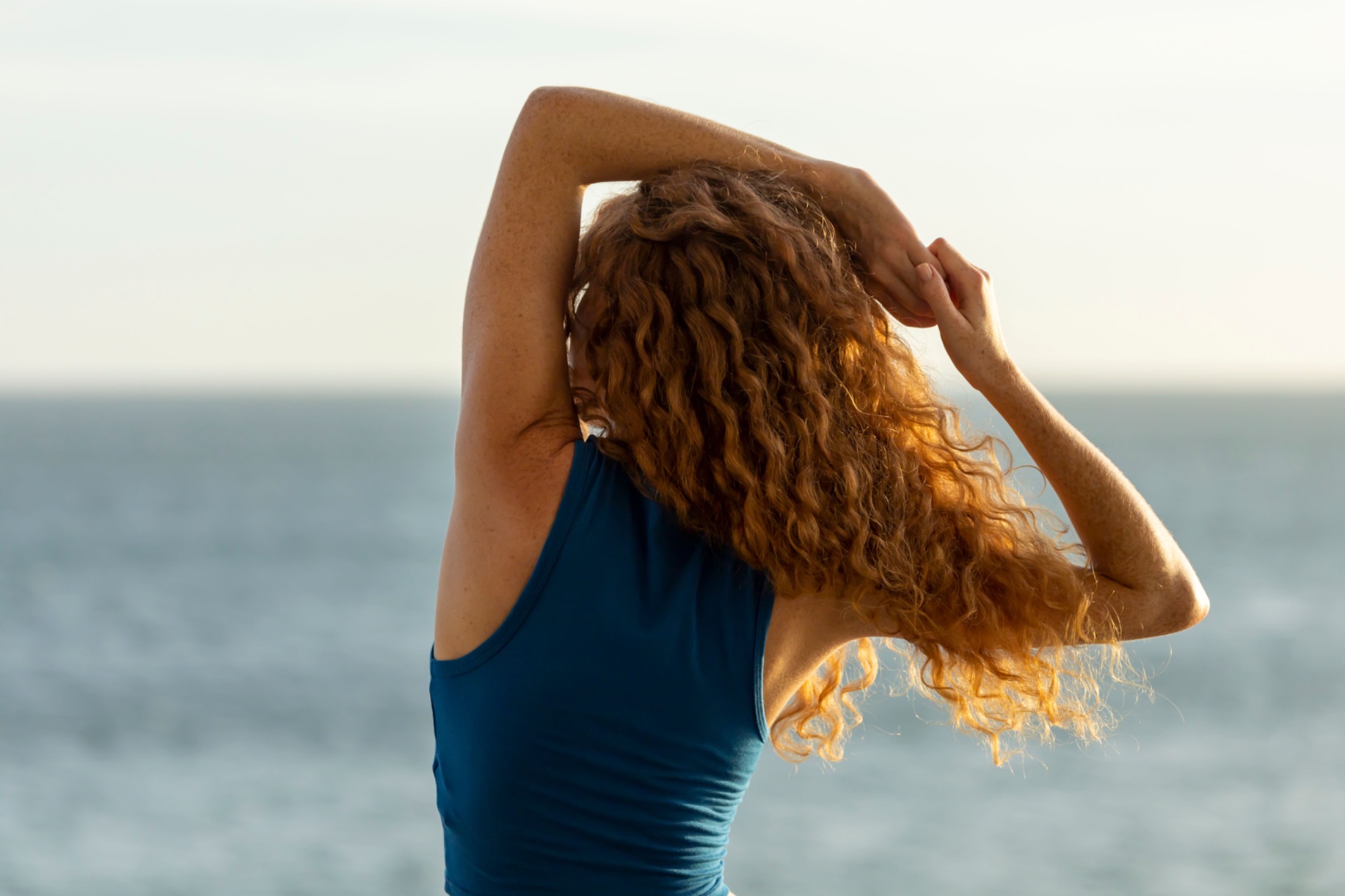 Young Woman with Golden Curly Hair